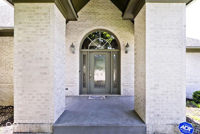 7844 N Timber Run Ct, Indianapolis, IN 46256 - doorway to property featuring brick siding