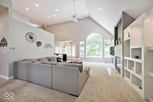 7844 N Timber Run Ct, Indianapolis, IN 46256 - living area with a ceiling fan, light colored carpet, a fireplace with flush hearth, high vaulted ceiling, and recessed lighting