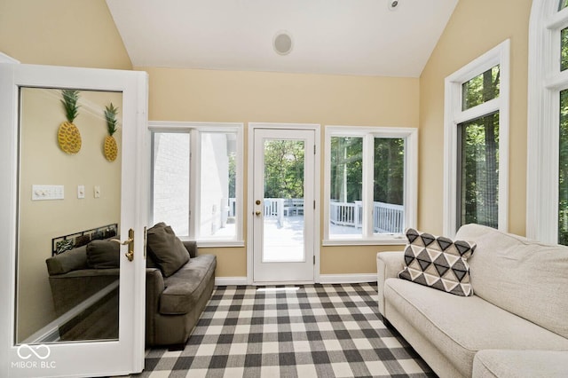 7844 N Timber Run Ct, Indianapolis, IN 46256 - carpeted living room featuring lofted ceiling and baseboards