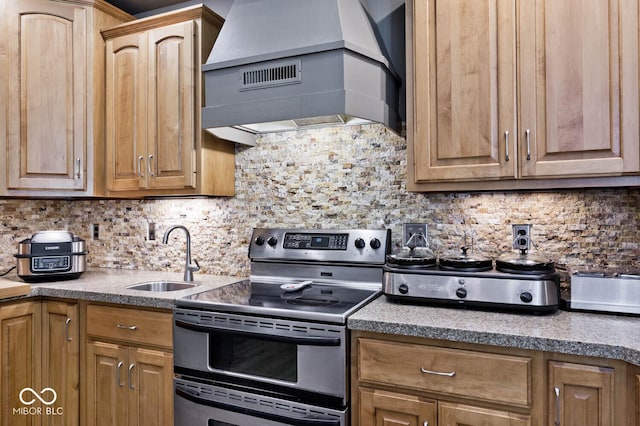 7844 N Timber Run Ct, Indianapolis, IN 46256 - kitchen with double oven range, wall chimney range hood, tasteful backsplash, and light countertops