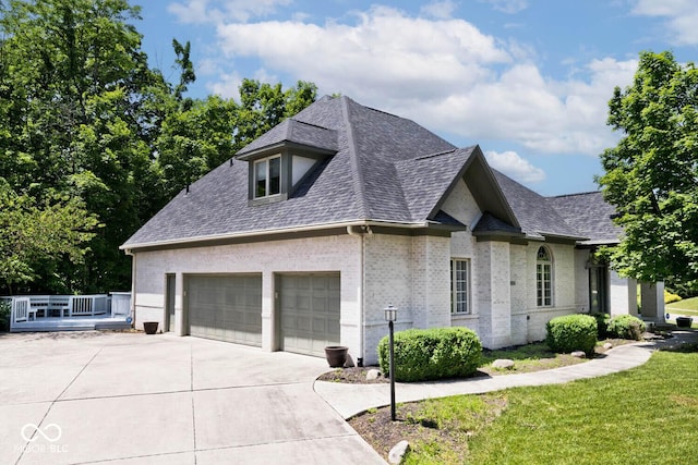 7844 N Timber Run Ct, Indianapolis, IN 46256 - view of front of property featuring roof with shingles, brick siding, driveway, a front lawn, and an attached garage