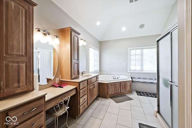 7844 N Timber Run Ct, Indianapolis, IN 46256 - bathroom featuring vaulted ceiling, a garden tub, tile patterned floors, and vanity