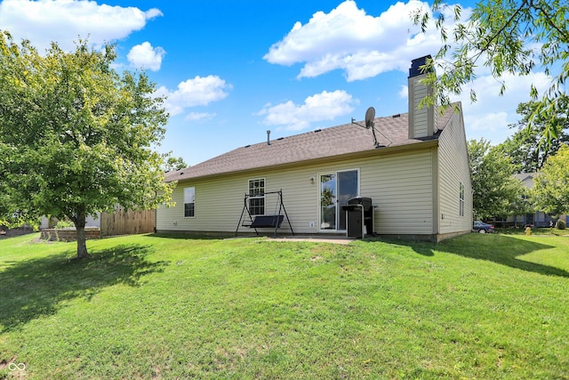 6417 Meadowpond Way, Indianapolis, IN 46235 - back of house featuring a patio area and a chimney