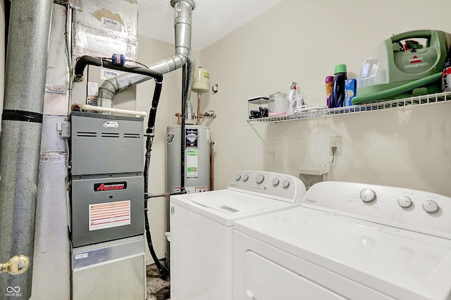 6417 Meadowpond Way, Indianapolis, IN 46235 - washroom with washing machine and dryer, heating unit, and water heater