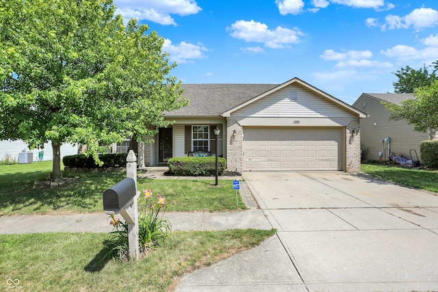 6417 Meadowpond Way, Indianapolis, IN 46235 - ranch-style home with a garage, concrete driveway, a front yard, and brick siding