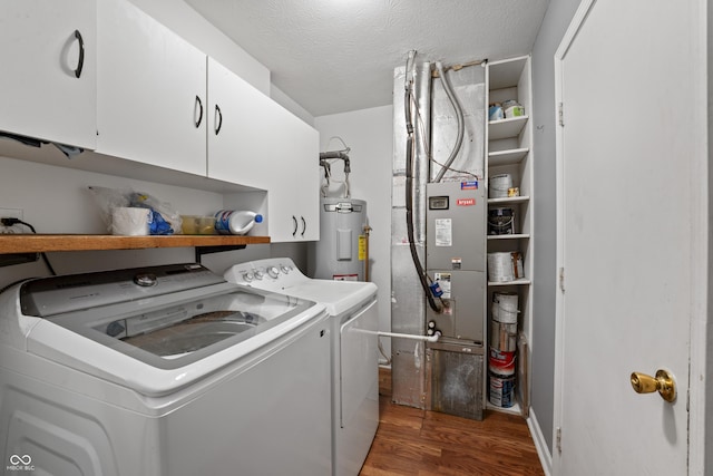 6933 Lohr Way, Indianapolis, IN 46214 - laundry room with cabinet space, water heater, independent washer and dryer, wood finished floors, and a textured ceiling