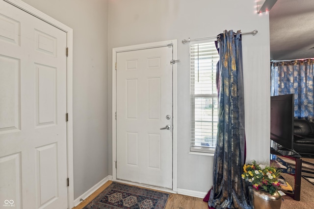 6933 Lohr Way, Indianapolis, IN 46214 - foyer featuring wood finished floors and baseboards