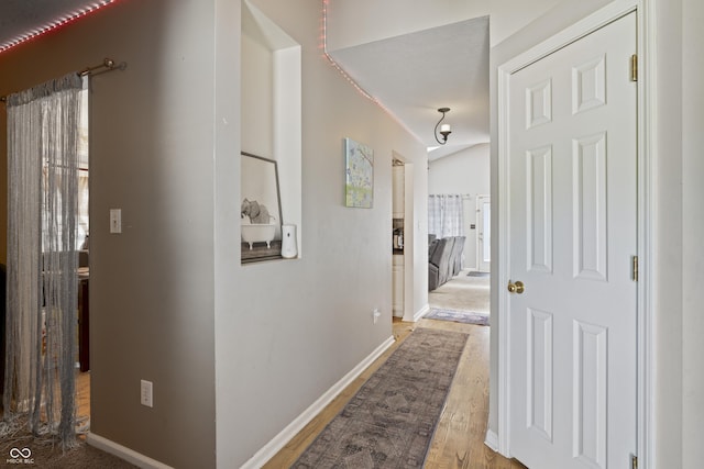 6933 Lohr Way, Indianapolis, IN 46214 - hall featuring wood finished floors and baseboards