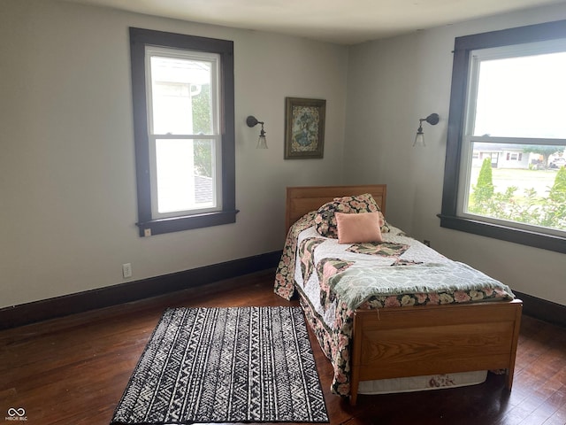 1402 SE 1st St, Evansville, IN 47713 - bedroom with wood finished floors and baseboards