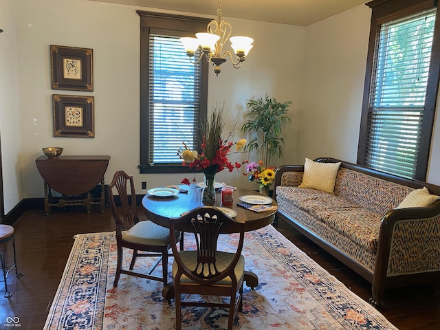 1402 SE 1st St, Evansville, IN 47713 - dining room featuring a chandelier, healthy amount of natural light, and wood finished floors
