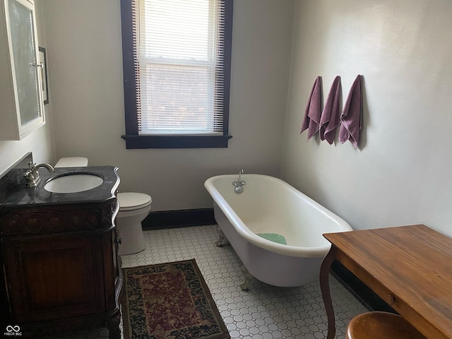 1402 SE 1st St, Evansville, IN 47713 - bathroom with a freestanding bath, vanity, and tile patterned floors