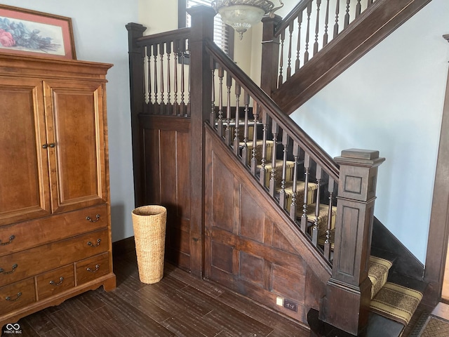1402 SE 1st St, Evansville, IN 47713 - stairs featuring wood finished floors and a chandelier