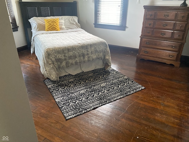 1402 SE 1st St, Evansville, IN 47713 - bedroom featuring dark wood-type flooring and baseboards