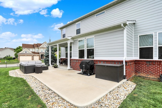 10490 Cleary Trace Dr, Fishers, IN 46040 - back of property featuring an outdoor living space, a patio, and brick siding