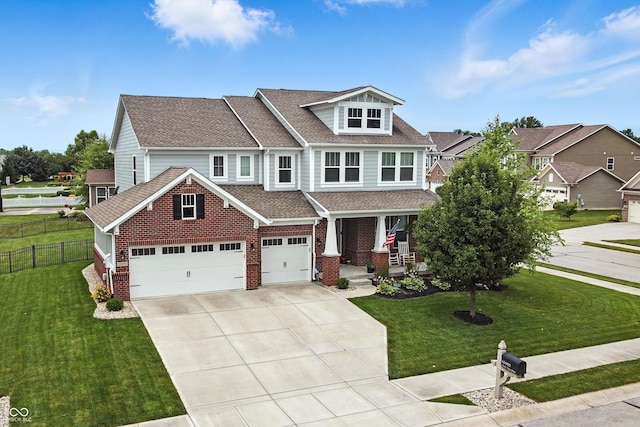 10490 Cleary Trace Dr, Fishers, IN 46040 - craftsman house featuring covered porch, concrete driveway, brick siding, and a shingled roof