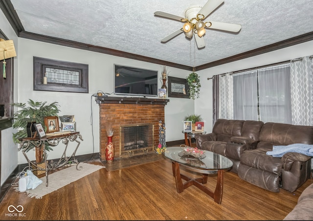 21 N Tremont St, Indianapolis, IN 46222 - living area featuring a textured ceiling, ceiling fan, wood finished floors, a fireplace, and ornamental molding
