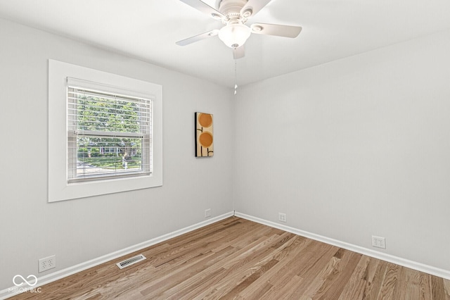 11329 Moss Dr, Carmel, IN 46033 - empty room featuring light wood-style floors and a ceiling fan