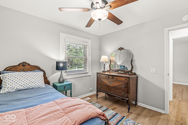 11329 Moss Dr, Carmel, IN 46033 - bedroom featuring wood finished floors and a ceiling fan