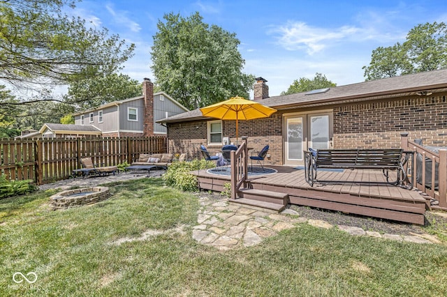 11329 Moss Dr, Carmel, IN 46033 - view of yard featuring a wooden deck and an outdoor living space with a fire pit