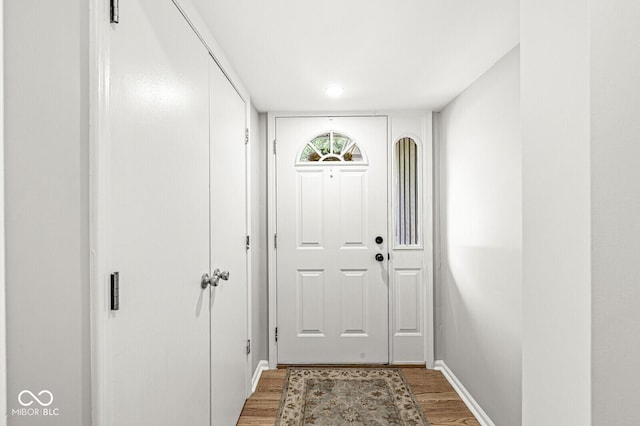 11329 Moss Dr, Carmel, IN 46033 - doorway to outside featuring light wood-style floors and baseboards