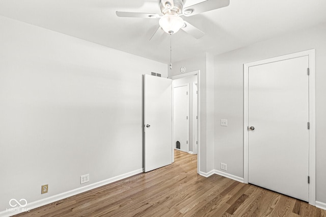 11329 Moss Dr, Carmel, IN 46033 - unfurnished bedroom with wood finished floors and a ceiling fan