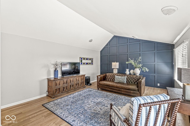 11329 Moss Dr, Carmel, IN 46033 - living area with vaulted ceiling and light wood-type flooring