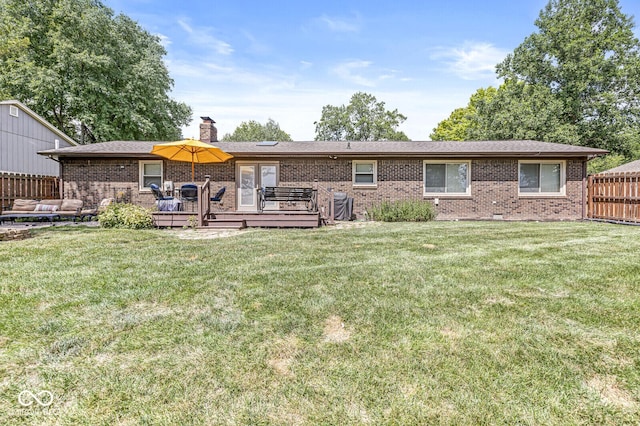 11329 Moss Dr, Carmel, IN 46033 - back of property with a deck, a chimney, brick siding, and an outdoor living space