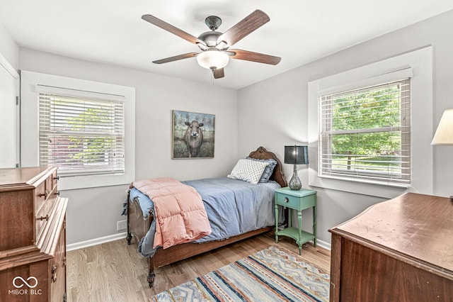 11329 Moss Dr, Carmel, IN 46033 - bedroom with wood finished floors and a ceiling fan