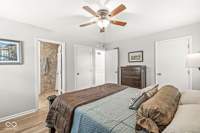11329 Moss Dr, Carmel, IN 46033 - bedroom featuring light wood-style flooring, ceiling fan, and ensuite bathroom