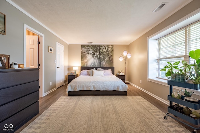 12854 Longleaf Ln, Fishers, IN 46038 - bedroom featuring wood finished floors and crown molding