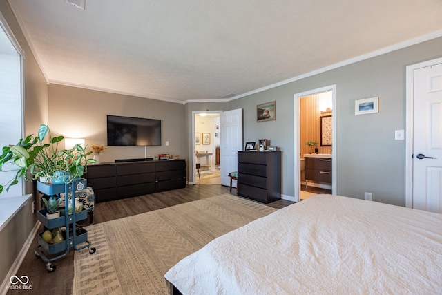 12854 Longleaf Ln, Fishers, IN 46038 - bedroom with wood finished floors, crown molding, and ensuite bathroom