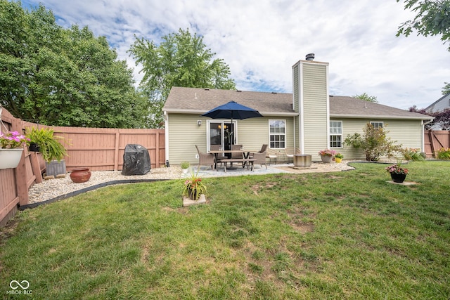 12854 Longleaf Ln, Fishers, IN 46038 - back of property with a chimney, a fenced backyard, and a patio
