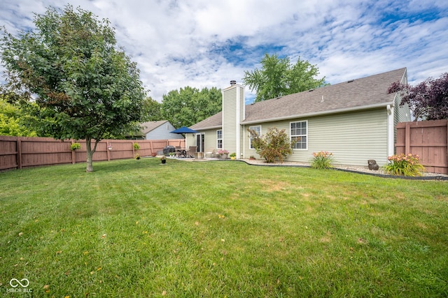 12854 Longleaf Ln, Fishers, IN 46038 - rear view of property with a patio, a fenced backyard, a chimney, and roof with shingles