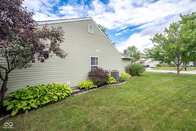 12854 Longleaf Ln, Fishers, IN 46038 - view of side of home with a central air condition unit and a lawn