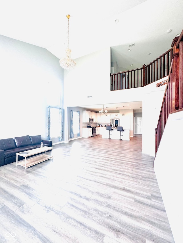 4732 Bethel Creek Blvd, Indianapolis, IN 46239 - common area with a high ceiling, stairs, and recessed lighting