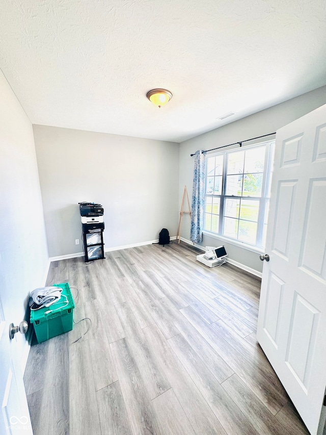 4732 Bethel Creek Blvd, Indianapolis, IN 46239 - unfurnished room featuring wood finished floors and a textured ceiling