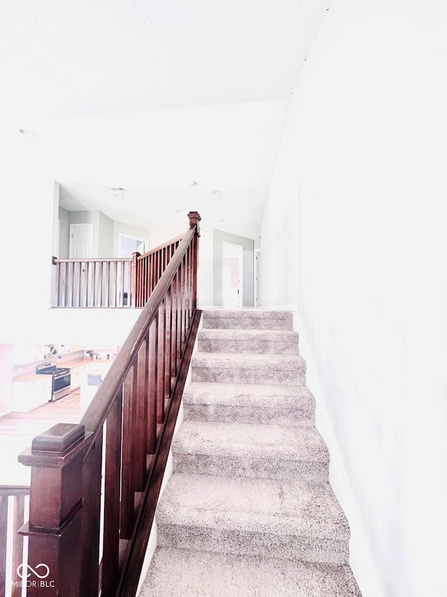 4732 Bethel Creek Blvd, Indianapolis, IN 46239 - staircase featuring baseboards and vaulted ceiling