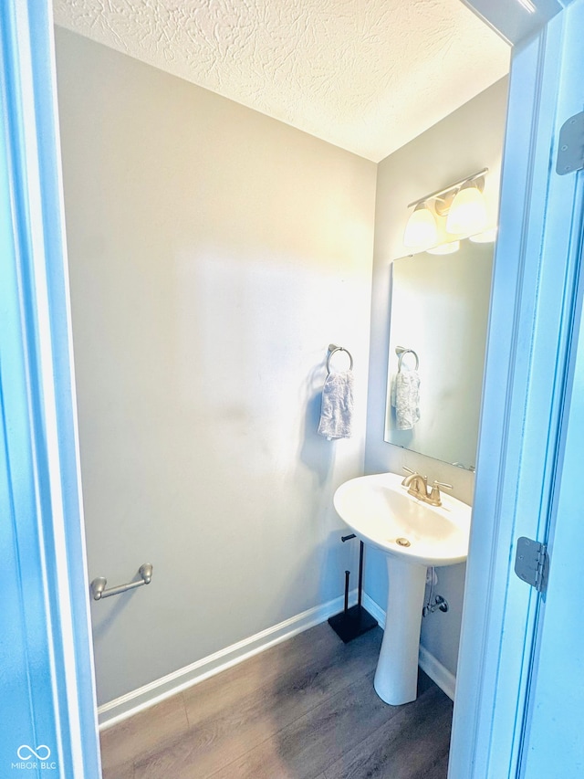 4732 Bethel Creek Blvd, Indianapolis, IN 46239 - bathroom featuring wood finished floors and a textured ceiling