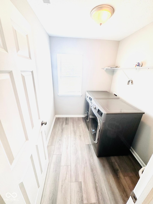 4732 Bethel Creek Blvd, Indianapolis, IN 46239 - washroom with separate washer and dryer and light wood-type flooring