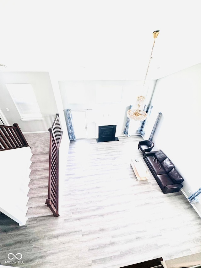 4732 Bethel Creek Blvd, Indianapolis, IN 46239 - unfurnished living room with wood finished floors and a fireplace