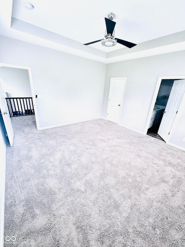 4732 Bethel Creek Blvd, Indianapolis, IN 46239 - carpeted spare room with a raised ceiling and ceiling fan