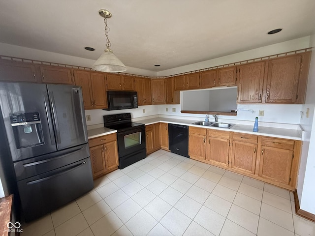 1338 Swan Dr, Franklin, IN 46131 - kitchen with black appliances, light countertops, brown cabinetry, and light tile patterned floors