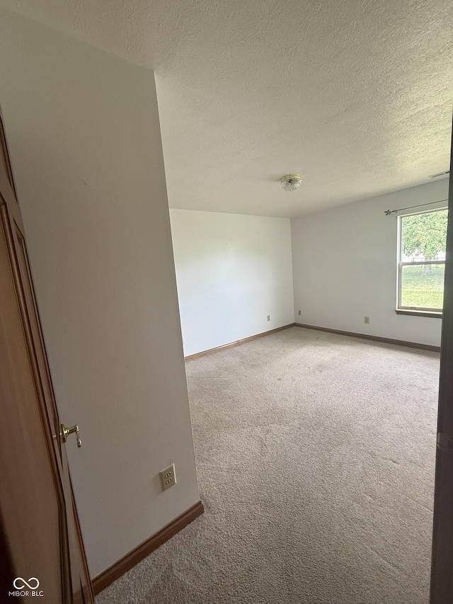 1338 Swan Dr, Franklin, IN 46131 - spare room featuring carpet and a textured ceiling