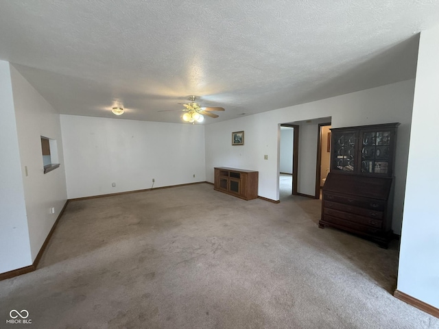 1338 Swan Dr, Franklin, IN 46131 - unfurnished living room with carpet floors, ceiling fan, and a textured ceiling