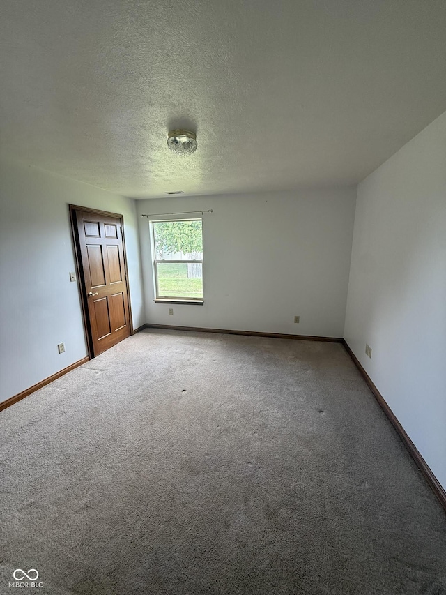 1338 Swan Dr, Franklin, IN 46131 - carpeted empty room featuring baseboards and a textured ceiling