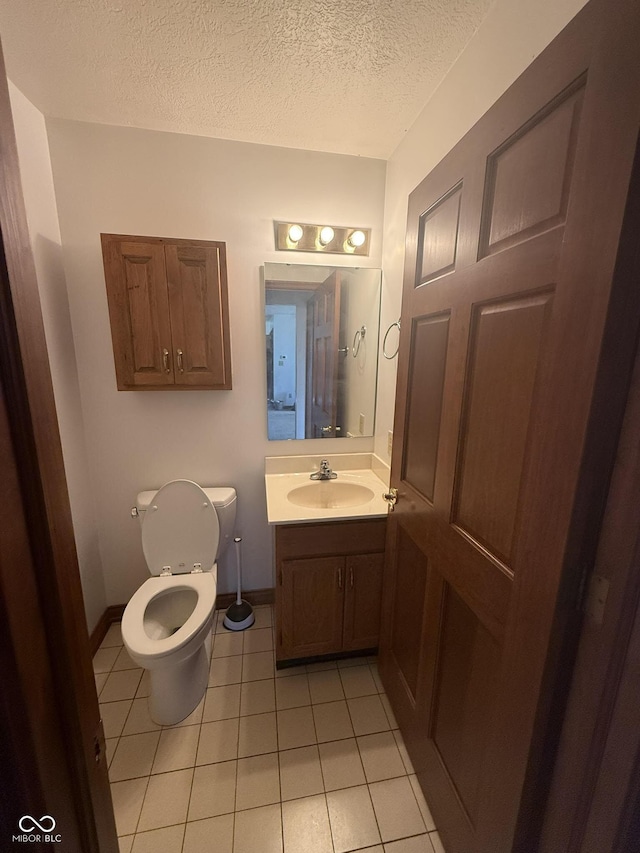 1338 Swan Dr, Franklin, IN 46131 - half bath featuring tile patterned floors, a textured ceiling, and vanity