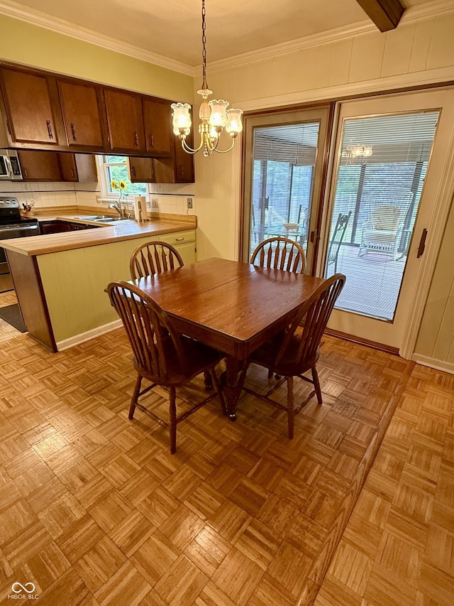 511 Canterbury Ct, Noblesville, IN 46060 - dining room featuring a chandelier, plenty of natural light, and ornamental molding