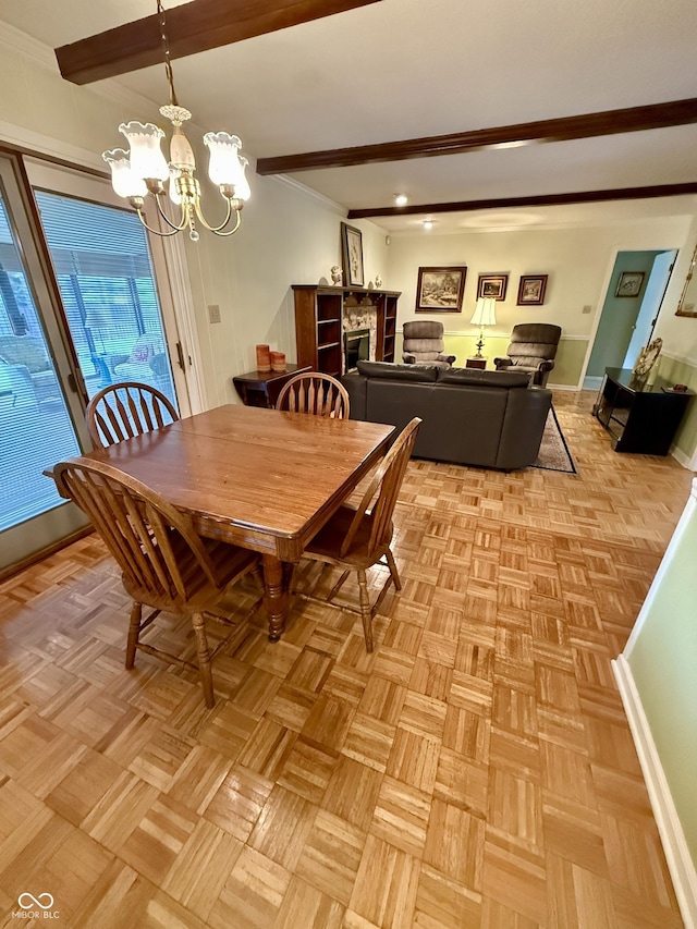 511 Canterbury Ct, Noblesville, IN 46060 - dining space featuring a chandelier, beam ceiling, and crown molding