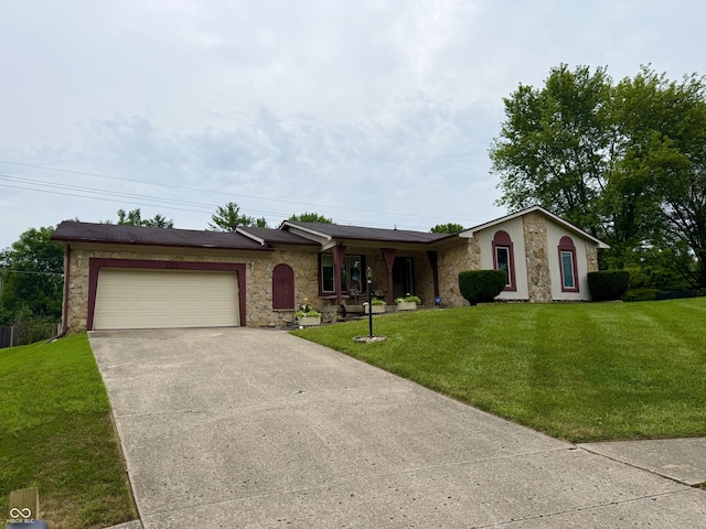 511 Canterbury Ct, Noblesville, IN 46060 - ranch-style house featuring stone siding, concrete driveway, an attached garage, and a front lawn