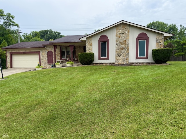 511 Canterbury Ct, Noblesville, IN 46060 - view of front of home with stone siding, a garage, concrete driveway, and a front lawn
